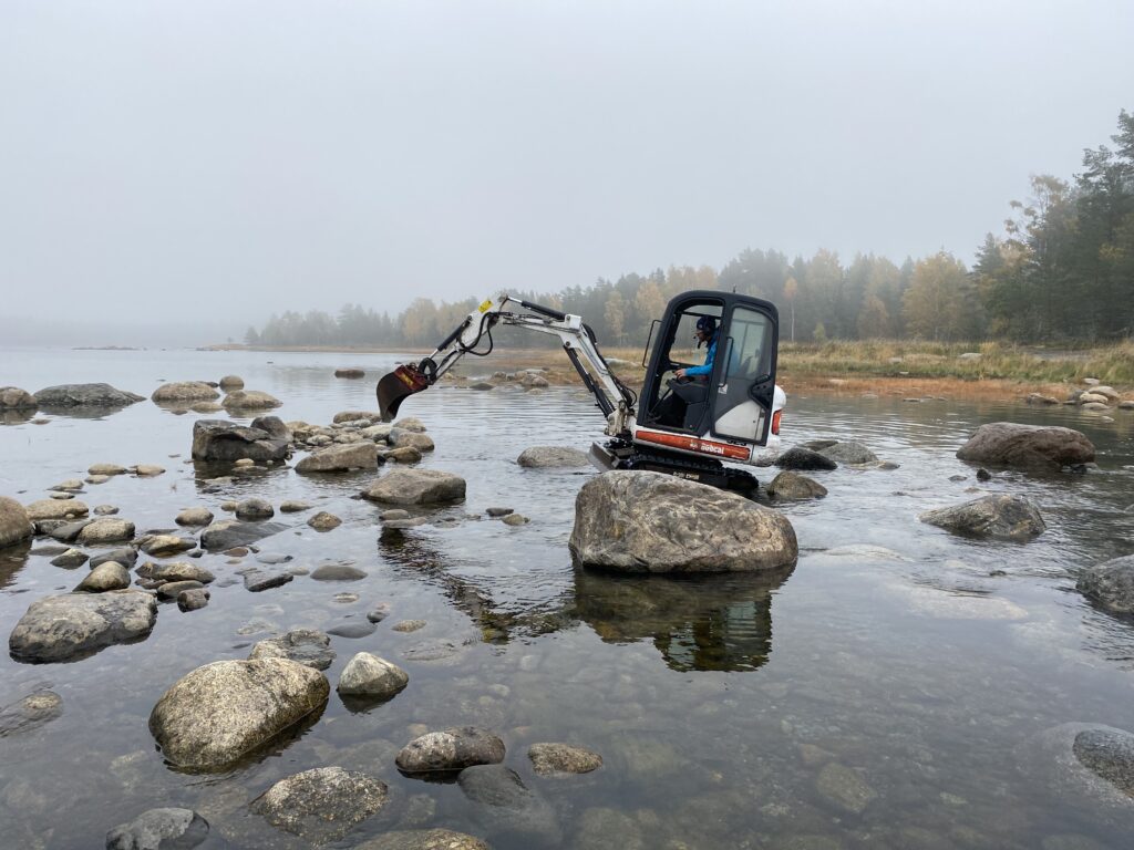 Digging machine standing in the water