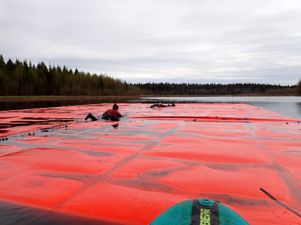 Red floating covers placed on the water
